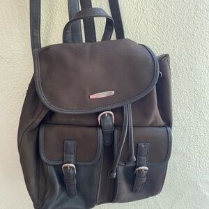 Nine West backpack purse with zippered access from back and adjustable straps.